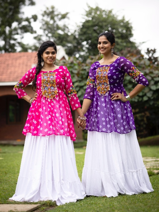 Women’s Lehenga with Kediya Top for Navratri – Rani, Purple, Green & Yellow | EthnicSuits.in Celebrate the joy of Navratri with our vibrant and traditional Women’s Lehenga with Kediya Top, specially designed for Garba and Dandiya nights. This colorful ethnic ensemble, featuring bold and festive shades like Rani, Purple, Green, and Yellow, is a true reflection of the season’s spirit and cultural heritage. At EthnicSuits.in, we bring you trendy yet traditional Navratri outfits that combine comfort with eye-catching design. This lehenga with kediya top is a must-have addition to your festive wardrobe! Colorful and Captivating Design This festive Navratri set includes: Lehenga (Skirt): Flowy and flared, designed with multi-color panels in shades of rani pink, purple, green, and yellow, creating a lively and playful look. Accented with traditional prints, embroidery, or mirror work (if applicable), it moves beautifully with every twirl. Kediya Top (Short Frock Style Top): Featuring a peplum-style flare with embroidered detailing or mirror accents, designed in a coordinating color palette. The Kediya top is inspired by Gujarati folk fashion, adding an authentic Garba vibe. Dupatta (Optional): A matching or contrast dupatta may be included with lace borders or tassels to complete the look. Ideal for Garba, Dandiya, and Navratri Nights Designed to reflect traditional Gujarati aesthetics with a modern twist, this lehenga-kediya set is perfect for dance performances, Navratri events, and festive celebrations. The combination of vibrant colors like rani and yellow with the richness of purple and green makes this outfit festive, joyful, and camera-ready. Comfortable Fit & Dance-Friendly Made with soft, breathable fabric, this set ensures all-night comfort during Garba or Dandiya raas. The lehenga’s flared cut allows for easy movement, while the kediya top offers a flattering silhouette that suits all body types. Why Buy from EthnicSuits.in? ✔ Traditional Navratri wear with a modern twist ✔ Festive colors: Rani, Purple, Green & Yellow ✔ Comfortable and lightweight materials ✔ Fast delivery and secure checkout ✔ Trusted brand for ethnic & festive fashion Get ready to dazzle this Navratri in our multi-color Lehenga with Kediya Top – a perfect fusion of style, tradition, and dance-friendly design. Order now from EthnicSuits.in and make every twirl count!