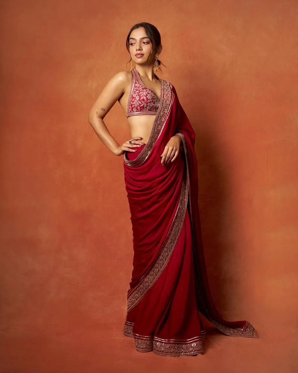 Ahsaas Channa wearing a red saree