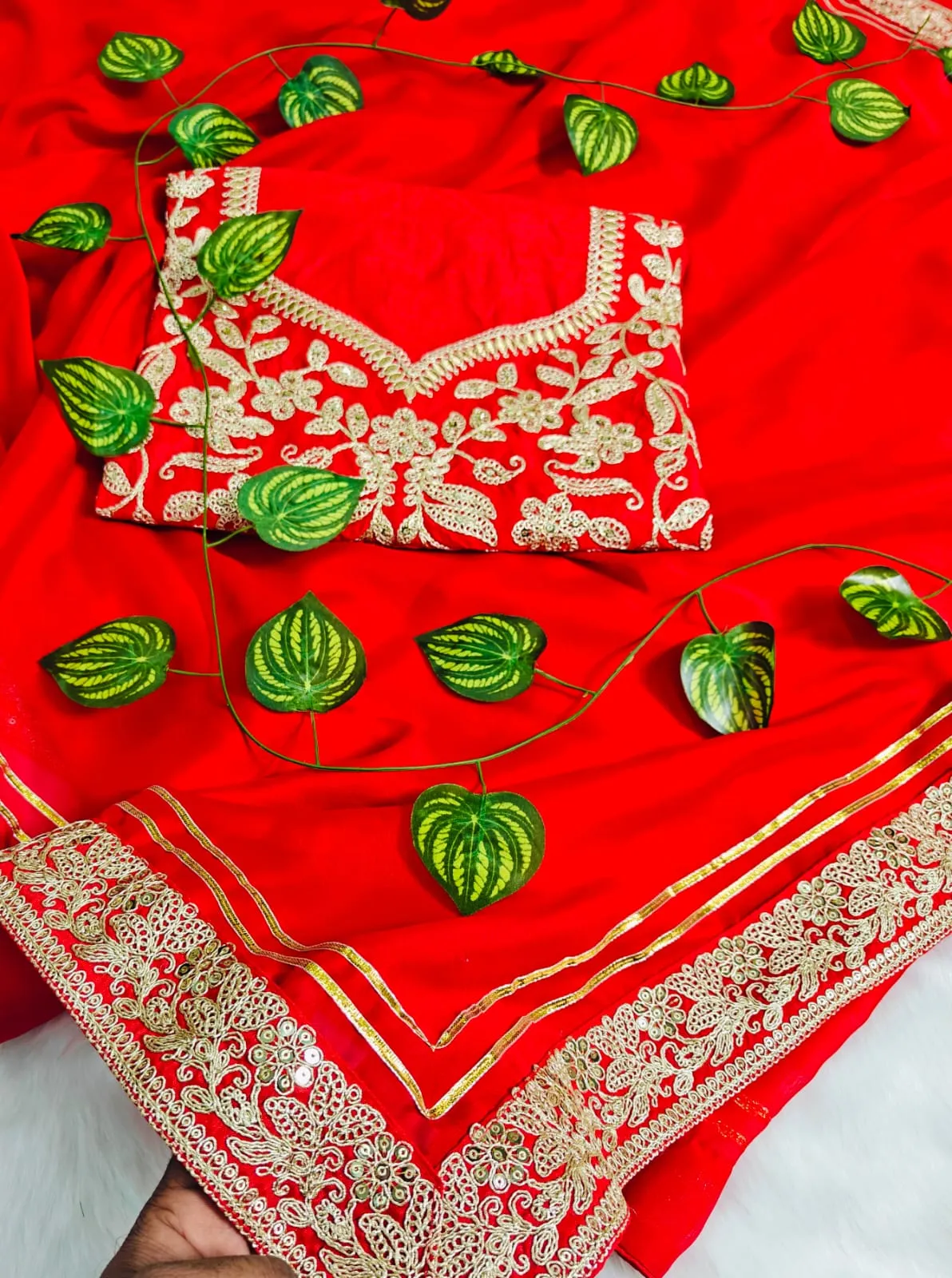 Ahsaas Channa wearing a red saree