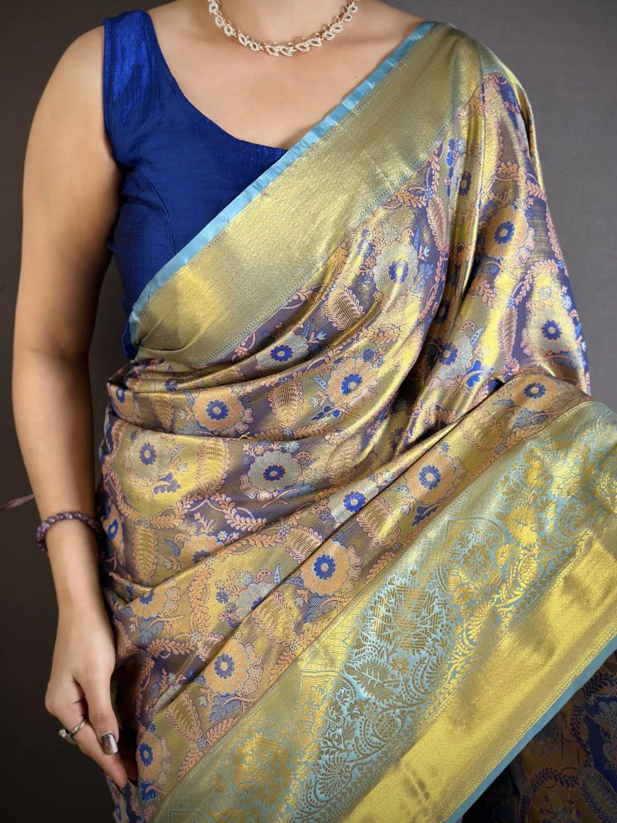 Blue Kanjivaram silk zari border saree for girls with woven pallu and traditional festive design