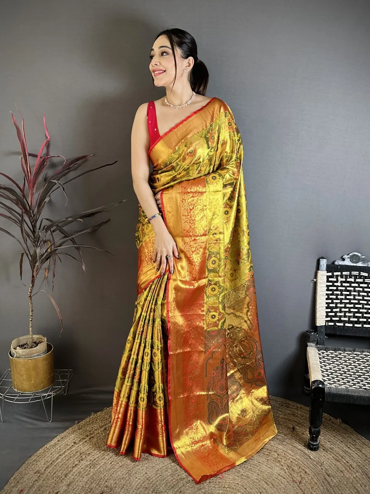 Golden traditional Kanjivaram silk saree for women with zari woven pallu and traditional festive design