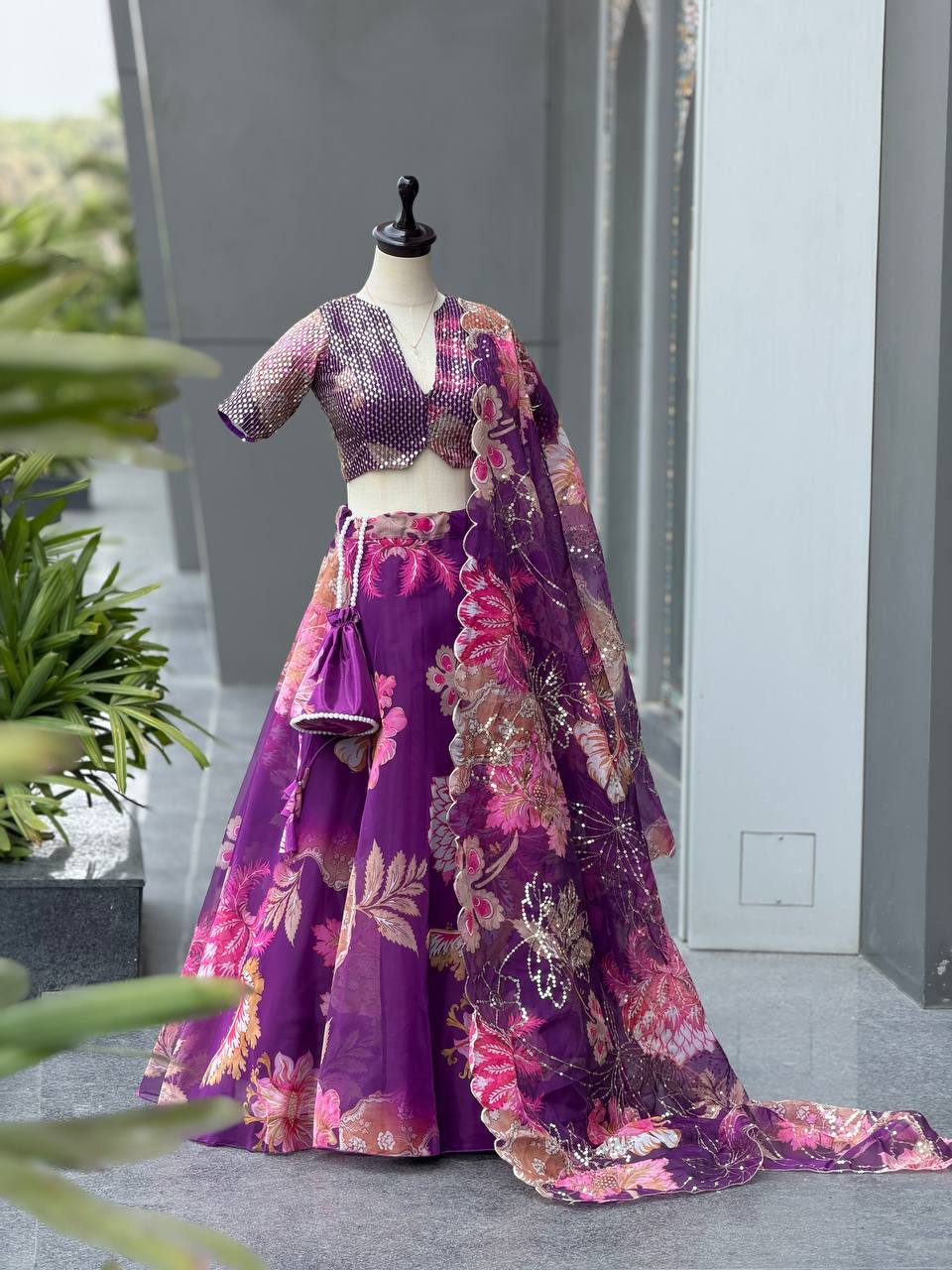 Purple Floral Organza Lehenga Choli with Embroidered Dupatta and Designer Batwa Bag