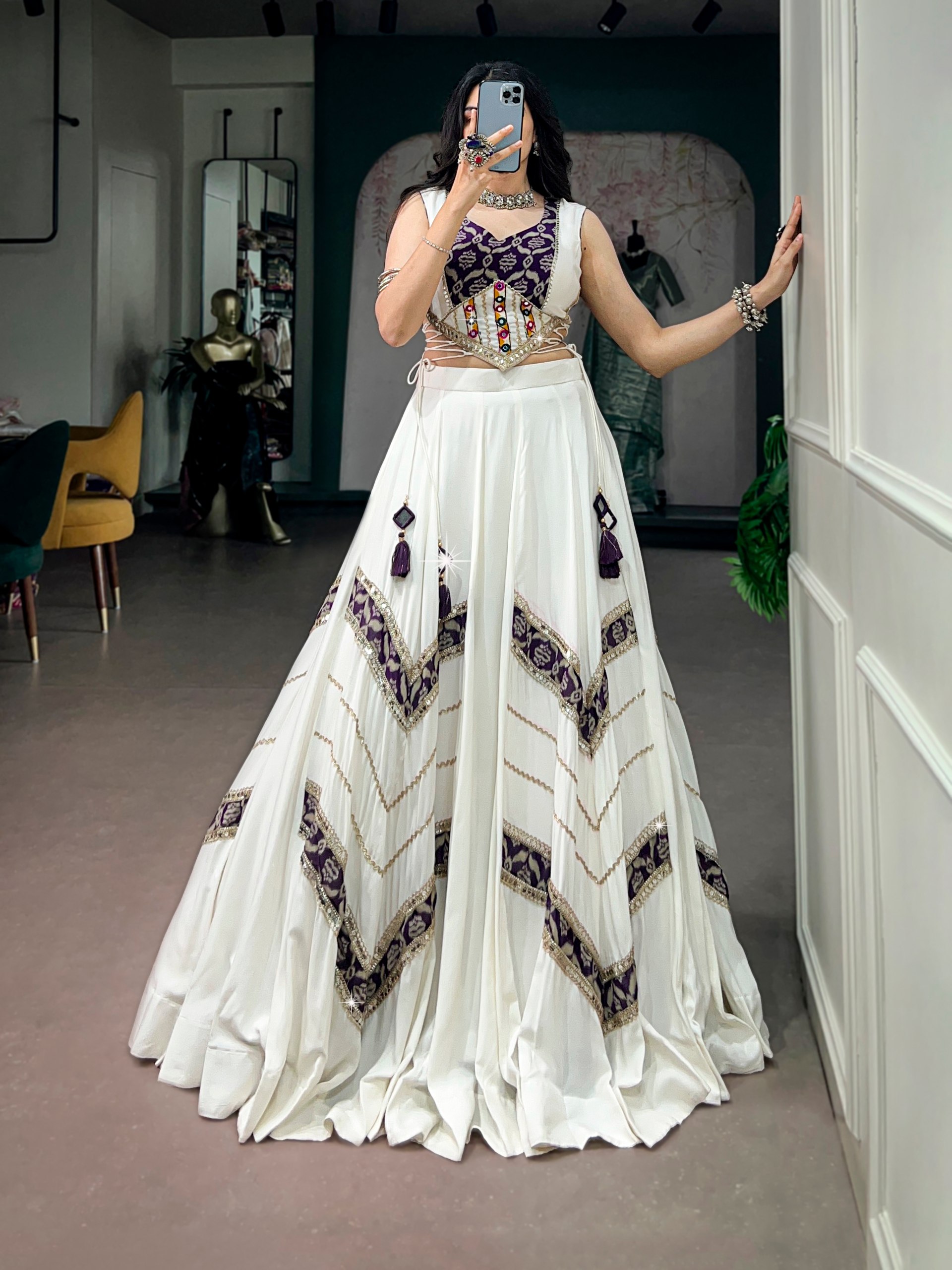 White Gamthi mirror work chaniya choli with blue zigzag print and silver lace detailing