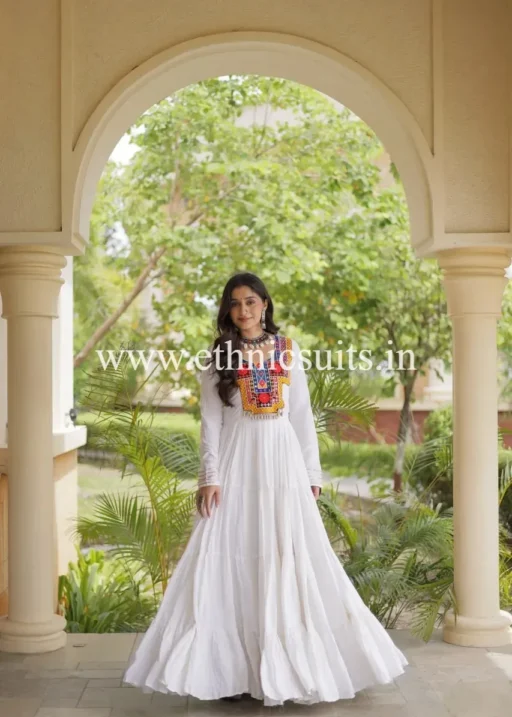 Kutchi work white anarkali gown styled with some mirrors and Traditional Kodi Work Lace with 12 mtr Flair
